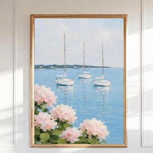 May include: An oil painting in a gold frame depicting three white sailboats on calm blue water. In the foreground, clusters of light pink hydrangea flowers with green leaves are visible. The sky is a pale, soft blue with light clouds.