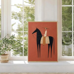 Folk art print of a figure in a wide-brim hat riding a tall dark horse with a tan saddle blanket on a warm terracotta background, vertical mid century equestrian wall art.
