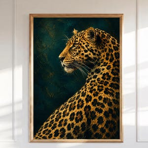 May include: A framed wall art print featuring a side profile of a leopard with golden fur and black rosettes. The leopard is positioned against a dark, textured teal and navy blue background, looking toward the left side of the frame.