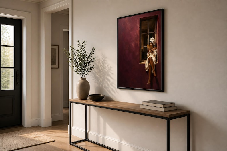 Painting of a Black woman in a white towel reading a golden book on a sunlit windowsill against a deep burgundy wall, moody figurative wall art print.