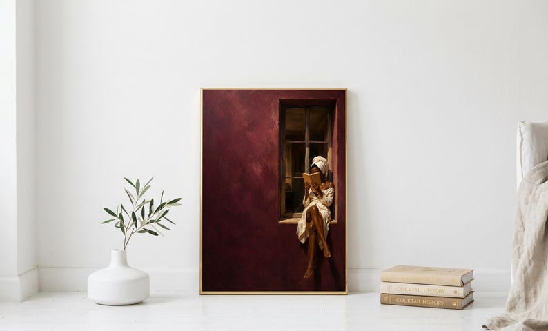 Painting of a Black woman in a white towel reading a golden book on a sunlit windowsill against a deep burgundy wall, moody figurative wall art print.