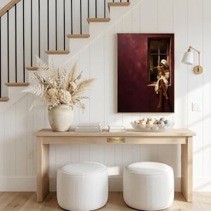 Painting of a Black woman in a white towel reading a golden book on a sunlit windowsill against a deep burgundy wall, moody figurative wall art print.