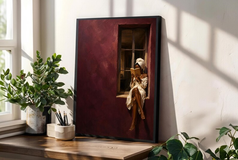 Painting of a Black woman in a white towel reading a golden book on a sunlit windowsill against a deep burgundy wall, moody figurative wall art print.