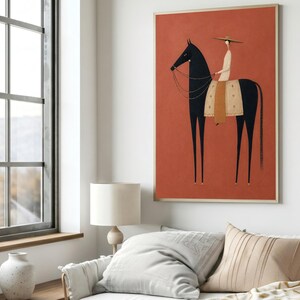 Folk art print of a figure in a wide-brim hat riding a tall dark horse with a tan saddle blanket on a warm terracotta background, vertical mid century equestrian wall art.