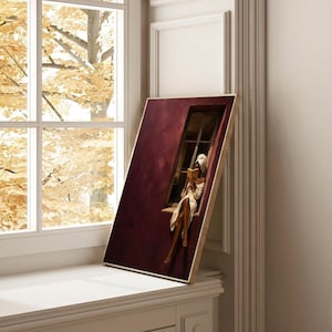 Painting of a Black woman in a white towel reading a golden book on a sunlit windowsill against a deep burgundy wall, moody figurative wall art print.