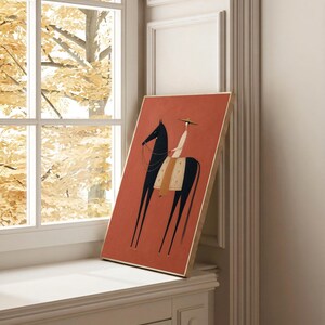 Folk art print of a figure in a wide-brim hat riding a tall dark horse with a tan saddle blanket on a warm terracotta background, vertical mid century equestrian wall art.