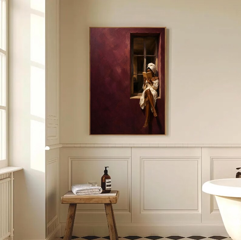 Painting of a Black woman in a white towel reading a golden book on a sunlit windowsill against a deep burgundy wall, moody figurative wall art print.