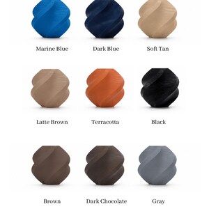 May include: A grid of nine small, spiraled, geometric vases labeled Color Options. The colors include marine blue, dark blue, soft tan, latte brown, terracotta, black, brown, dark chocolate, and gray. Each vase features a distinct twisted texture.