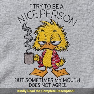 May include: A heather grey fabric featuring an embroidered yellow duck with messy hair, wearing a red and white patterned shirt, holding a steaming grey mug. The text reads: I TRY TO BE A NICE PERSON BUT SOMETIMES MY MOUTH DOES NOT AGREE.