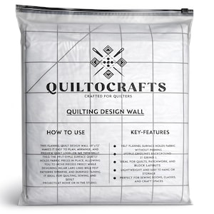 May include: A quilting design wall in a clear plastic bag. The wall is white with a grid pattern and text that reads "QUILTOCRAFTS" and "QUILTING DESIGN WALL". The wall measures 60" x 72".