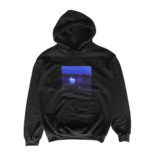 May include: Black hooded sweatshirt with a kangaroo pocket and drawstring hood. The front features a rectangular graphic of a blue and white image. The sweatshirt is made of a soft material.