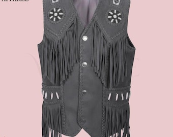 May include: Gray suede vest with fringe, decorative beading, and silver buttons. The vest has a V-neck and is from Vintage Hide Apparel.