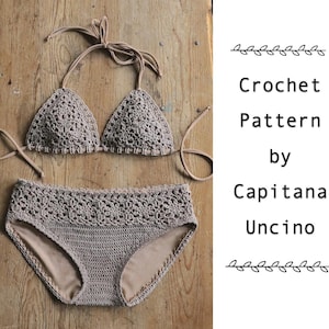 May include: A taupe crochet bikini set with triangle top and high-waisted bottoms. The bikini is made of a textured, open-weave material. The text "Crochet Pattern by Capitana Uncino" is on the right side of the image.