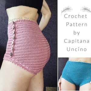 Peut inclure: Deux shorts en crochet taille haute, l'un rose et l'autre bleu. Les shorts ont une fermeture à bouton et un bord festonné. Le texte "Capitana Uncino" est visible sur l'image.