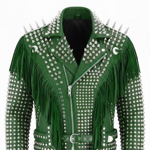 May include: Green leather jacket with silver spikes and studs. The jacket has fringe on the chest and sleeves, a zip front, and a buckled belt. The collar features long silver spikes.