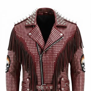 May include: A burgundy leather jacket with silver metal studs and fringe detailing. The jacket features a zip closure, a belt, and patches with skull and flame designs. The shoulders are adorned with silver spikes.