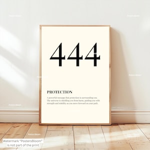 May include: A framed print with the number 444 in bold black font at the top. Below the number is the word "PROTECTION" and a description about protection. The background is a cream color.