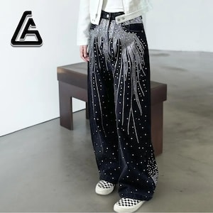 Unisex Rhinestone Pants | Wide Leg Studded Jeans | Glitter Streetwear Fashion Bottoms
.
Wide-leg black pants decorated with cascading rhinestones and glitter stud details shown in a studio setting.