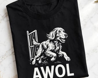May include: A black crew neck t-shirt featuring a white graphic illustration of a dog running through an open gate. Below the dog, the word AWOL is printed in bold, white, capital letters. The design is centered on the front of the garment.