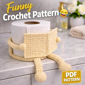 May include: A roll of white toilet paper is encased in a light yellow crocheted holder with arms and legs. The text "Funny Crochet Pattern" is at the top, and "PDF PATTERN" is at the bottom.