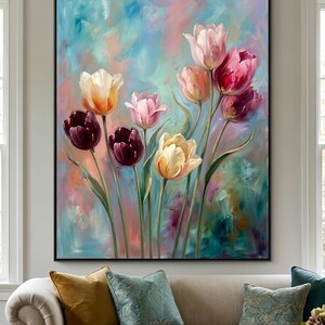 May include: A large framed painting featuring a bouquet of tulips in various colors, including deep burgundy, yellow, and pink. The background is a blend of blue, pink, and green hues, creating a soft, artistic effect. The painting is displayed above a beige sofa.