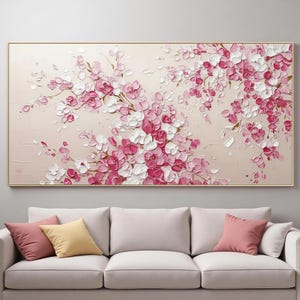 May include: A rectangular wall art piece featuring a thick impasto oil painting of cherry blossom branches. The artwork displays clusters of textured pink and white flower petals against a solid light beige background, framed in a thin gold border.