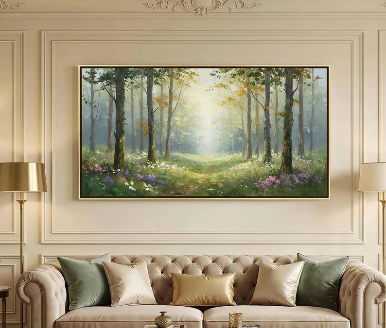 May include: A rectangular landscape painting in a thin gold frame depicting a sunlit forest scene with tall trees, green foliage, and patches of white and purple wildflowers on the forest floor, rendered in a soft, painterly style with light.