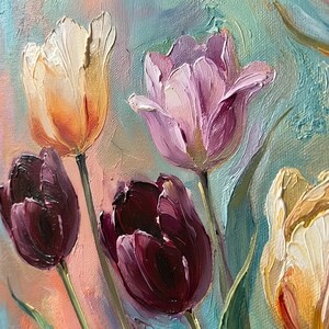 May include: Close-up of an oil painting featuring vibrant tulips. The flowers display a range of colors, including deep burgundy, soft pink, and creamy yellow, set against a textured, pastel-colored background. Green stems and leaves add contrast to the floral arrangement.