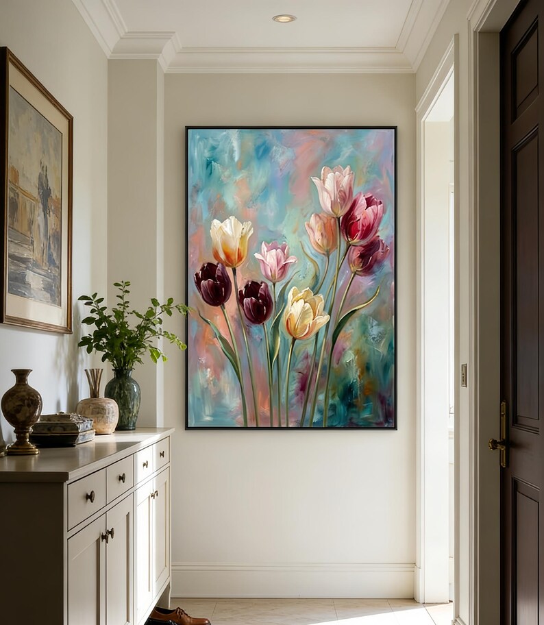 May include: A large framed painting of tulips in various colors, including deep burgundy, yellow, and pink, against a soft blue and green background. The artwork is displayed on a white wall in a well-lit hallway.