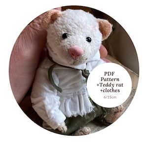 May include: A handmade white teddy rat doll with a pink nose and black eyes, wearing a white shirt and green pants. The doll is approximately 6 inches tall. Text on the image reads "PDF Pattern +Teddy rat +clothes 6/15cm."