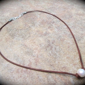 Leather and  Pearl necklace with sterling silver clasp and single Pear 17” your choice black or brown leather cord and freshwater pearl