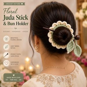 May include: A crochet bun holder featuring a cream-coloured scalloped floral design with a dark brown wooden stick. Two sage green crocheted leaves with small white beads hang from the side. Text on the image reads Floral Juda Stick & Bun Holder.