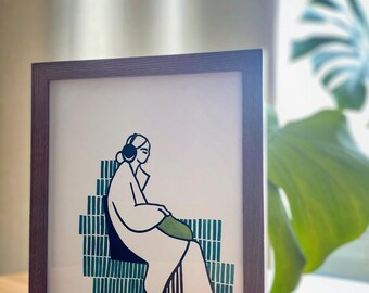 Linograbado original con detalles pintados a mano.