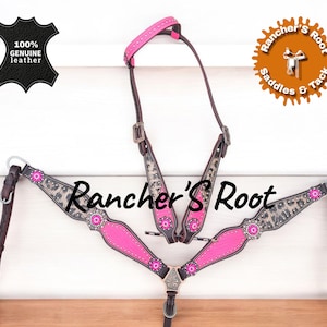 May include: A pink and brown leather horse tack set with a leopard print design and silver accents. The set includes a headstall, breast collar, and reins. The text "Rancher's Root" is displayed on the tack.