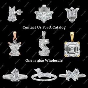 May include: A selection of diamond jewellery, including earrings, pendants, and rings. The image showcases various designs, such as a bunny, a butterfly, a star, and a dog. Text on the image reads "Contact Us For A Catalog" and "One is also Wholesale."