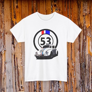 May include: White t-shirt with a graphic of a vintage white car, the number 53, and red, white, and blue stripes. The number 53 is also in a black circle with red and blue stripes. The car has the number 53 on the side.