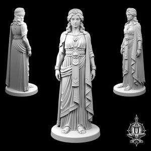 May include: A light gray 3D printed figurine of a standing figure wearing a long, pleated robe with a wide belt, a necklace, and a headband. The figure is shown from three different angles, including front, side, and back views, on a round base.