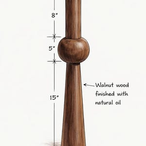 May include: A walnut furniture leg, finished with natural oil. The leg is 38 cm tall, 13 cm wide at the base, and 5 cm wide at the top. The middle section is 13 cm, and the top section is 20 cm.