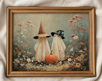 May include: A framed oil painting depicting two white sheet ghosts standing in a field of colorful wildflowers. One ghost wears a brown pointed hat, the other a black hat with a blue bow. An orange pumpkin sits at their feet in the grass.
