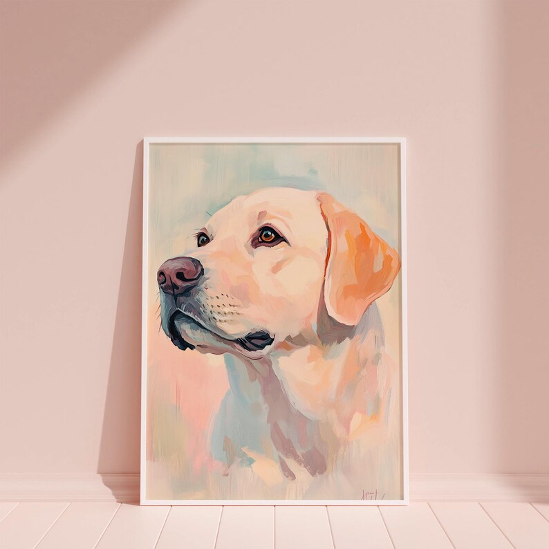 May include: A framed watercolor painting of a yellow Labrador Retriever. The dog is depicted in profile, with a soft, pastel color palette of cream, peach, and light blue. The dog's eyes are brown, and the nose is pink.