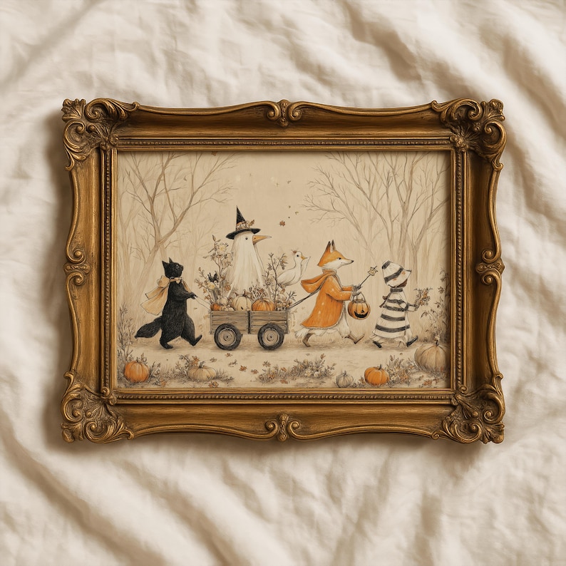 May include: A rectangular wall art piece in an ornate gold frame featuring an illustration of a black cat, a ghost in a witch hat, a fox in an orange cloak, and a child in a striped outfit pulling a wooden wagon filled with pumpkins.
