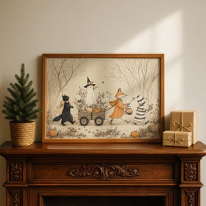 May include: A framed illustration in a wooden frame depicting a black cat, a ghost, a fox, and a striped creature pulling a wooden wagon filled with pumpkins through a forest. The scene includes bare trees and scattered pumpkins on the ground.