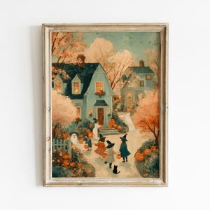 May include: A framed art print depicting a Halloween scene with children in witch costumes and ghosts walking toward a blue house. The landscape features orange autumn trees, scattered pumpkins, and a black cat on a path in a soft, painterly style.