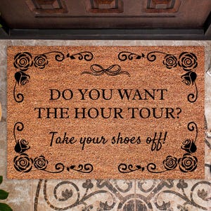 May include: A set of three ceramic mugs with a speckled, matte finish. The mugs are in shades of cream, light gray, and dark gray. Each mug has a simple, modern design and a rounded handle. The mugs are stacked on top of each other.