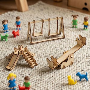 May include: A wooden playset with a swing set, slide, and seesaw. Miniature figurines of children and animals are scattered around the playset. The toys are made of light-colored wood and are set on a textured, neutral-colored surface.