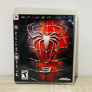 May include: A PlayStation 3 video game case for Spider-Man 3. The cover features a large silver spider emblem over a red and black textured background. The case includes the PlayStation 3 logo, the ESRB Teen rating, and the Activision logo.