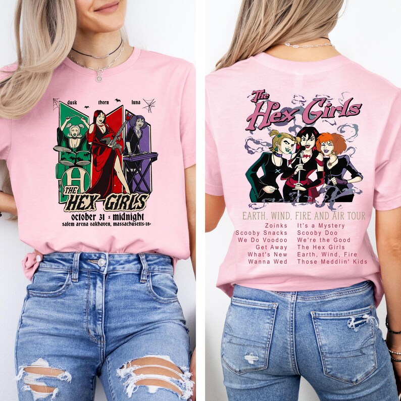 May include: Pink t-shirt featuring "The Hex Girls" graphic on the front and back. The front design includes the band's name, date, and location. The back design shows the band members with tour details. A fun, colorful tee.