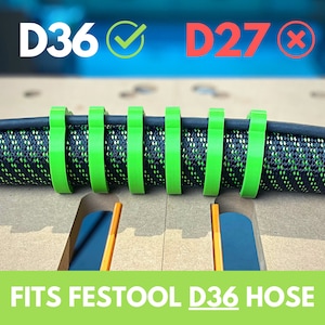 May include: Green hose clamps for a Festool D36 hose. The clamps are made of a flexible plastic and are designed to fit snugly around the hose. The image shows the clamps in place on the hose, with the text "FITS FESTOOl D36 HOSE" displayed below.