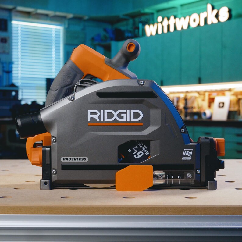 May include: A gray and orange Ridgid 7 1/4-inch circular saw with a brushless motor. The saw is on a wooden surface with a label that says "wittworks".