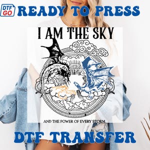 May include: White t-shirt with a circular design featuring two dragons, one black and one blue, surrounded by clouds and the text "I AM THE SKY AND THE POWER OF EVERY STORM." The words "READY TO PRESS" and "DTF TRANSFER" are also visible.